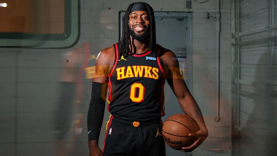 Lu Dort prefere uma medalha de ouro do Canadá ao campeonato dos Hawks. Essa escolha reflete um valor maior na oportunid…