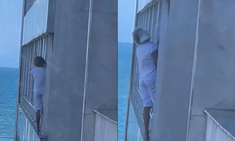 A domestica se pendurando no parapeito de apartamento no Leblon para limpar janela. Sem equipamento de segurança, nesse…