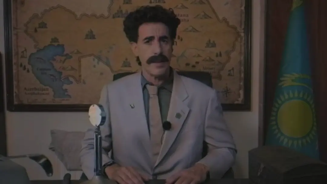 Sacha Baron Cohen usou o Borat para defender o Ali G no trailer novo do Who Iz I?. Ele também ressuscitou o Coronel Err…